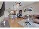 Inviting living room featuring hardwood floors, modern lighting, and open layout to kitchen and a daring dance pole at 200 W Sahara Ave # 603, Las Vegas, NV 89102