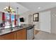Bright living area showcasing the kitchen counter, living room decor, and city skyline view at 200 W Sahara Ave # 603, Las Vegas, NV 89102