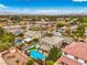 Overhead view captures a lovely neighborhood scene, emphasizing a home with a refreshing pool and a green, landscaped yard at 2959 Azure Bay St, Las Vegas, NV 89117