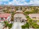 Stunning aerial view of the property showcasing its well-manicured lawns, spacious driveway, and desirable location at 2959 Azure Bay St, Las Vegas, NV 89117