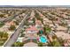 Expansive aerial view of a vibrant neighborhood featuring a beautiful home with a private pool and manicured landscaping at 2959 Azure Bay St, Las Vegas, NV 89117