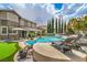 Amazing backyard features a large pool, putting green, lounge chairs, and beautiful landscaping at 2959 Azure Bay St, Las Vegas, NV 89117