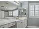 The primary bath features double sinks, a large mirror, and a separate tub and shower at 2959 Azure Bay St, Las Vegas, NV 89117