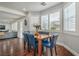 Sunlit dining area with hardwood floors and views of the backyard at 2959 Azure Bay St, Las Vegas, NV 89117