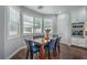 Dining nook featuring a wooden table, blue upholstered chairs, and bright, natural light at 2959 Azure Bay St, Las Vegas, NV 89117