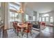 Elegant dining room featuring a large window, wood table and chandelier at 2959 Azure Bay St, Las Vegas, NV 89117