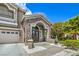 Close-up of the front door with stone accents and a well-manicured lawn at 2959 Azure Bay St, Las Vegas, NV 89117