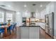 Bright kitchen with stainless steel appliances and an island with seating at 2959 Azure Bay St, Las Vegas, NV 89117