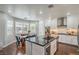 Open kitchen features stainless steel appliances, an island, and a breakfast nook at 2959 Azure Bay St, Las Vegas, NV 89117