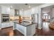 Modern kitchen boasting stainless steel appliances and a large island with dark countertops at 2959 Azure Bay St, Las Vegas, NV 89117