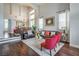 Open-concept living room with hardwood floors, high ceilings, and a view of the dining area at 2959 Azure Bay St, Las Vegas, NV 89117