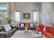 Comfortable living room with neutral walls, high ceiling, and plush seating area at 2959 Azure Bay St, Las Vegas, NV 89117
