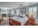 Spacious main bedroom featuring a fireplace, wood floors, and neutral decor at 2959 Azure Bay St, Las Vegas, NV 89117