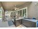 Covered patio area with comfortable seating and ceiling fans for outdoor living at 2959 Azure Bay St, Las Vegas, NV 89117