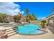 Fabulous pool and spa surrounded by lush landscaping, offering a serene and inviting outdoor experience at 2959 Azure Bay St, Las Vegas, NV 89117