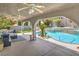 Beautiful backyard featuring covered patio seating, pool and spa perfect for relaxing and entertaining at 2959 Azure Bay St, Las Vegas, NV 89117