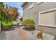 Lush landscaping and a stone pathway creates a picturesque yard, perfect for enjoying the outdoors at 2959 Azure Bay St, Las Vegas, NV 89117