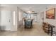 Dining area features tile floors, breakfast bar, and adjacent kitchen with white cabinetry at 3125 N Buffalo Dr # 1103, Las Vegas, NV 89128