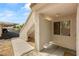 Condo entrance with textured walls, window, covered parking, and paver entryway at 3125 N Buffalo Dr # 1103, Las Vegas, NV 89128