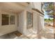 Condo entry featuring security door, twin windows, and large storage closet at 3125 N Buffalo Dr # 1103, Las Vegas, NV 89128