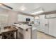 Bright kitchen features white cabinets, modern appliances, and a breakfast bar for casual dining at 3125 N Buffalo Dr # 1103, Las Vegas, NV 89128