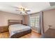 Cozy main bedroom featuring a ceiling fan and a large bed with side tables at 3125 N Buffalo Dr # 1103, Las Vegas, NV 89128