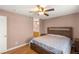 View of the main bedroom showing a neutral color palette and a comfortable bed at 3125 N Buffalo Dr # 1103, Las Vegas, NV 89128