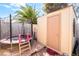 Backyard with storage shed, trampoline, greenery, and fenced yard at 3145 Tarpon Dr, Las Vegas, NV 89120