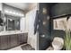 Stylish bathroom featuring modern fixtures, a dual-sink vanity, and trendy decor accents at 3145 Tarpon Dr, Las Vegas, NV 89120