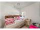 Cozy bedroom with white walls, a comfortable bed, and natural light from the window at 3145 Tarpon Dr, Las Vegas, NV 89120