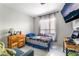 Comfortable bedroom featuring a cozy bed, a window with sheer curtains, and a TV at 3145 Tarpon Dr, Las Vegas, NV 89120