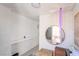 Bright hallway with white shiplap walls, a round mirror, and stylish decor at 3145 Tarpon Dr, Las Vegas, NV 89120