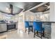 Stylish kitchen with stainless steel appliances, granite countertops, and tile backsplash, open to the living space at 3145 Tarpon Dr, Las Vegas, NV 89120
