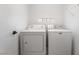Laundry room featuring standard washer and dryer units, and light gray walls at 3145 Tarpon Dr, Las Vegas, NV 89120