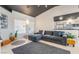 Open-concept living room flowing into the kitchen, featuring tiled floors and modern furnishings at 3145 Tarpon Dr, Las Vegas, NV 89120