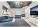 Open concept living room with a fireplace, sleek tiled floors, and comfortable seating, creating a welcoming space at 3145 Tarpon Dr, Las Vegas, NV 89120