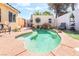 Backyard featuring a private pool, mature trees, lounge furniture, and desert landscaping at 3145 Tarpon Dr, Las Vegas, NV 89120