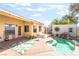 Backyard featuring a private pool, mature trees, lounge furniture, and desert landscaping at 3145 Tarpon Dr, Las Vegas, NV 89120