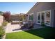 Relaxing backyard featuring a dining area, manicured plants and a built-in spa at 32 Via Del Fiume, Henderson, NV 89011