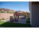 Inviting backyard with dining set, spa, and privacy wall for serene outdoor living at 32 Via Del Fiume, Henderson, NV 89011