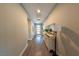 Inviting hallway features sleek hardwood floors and elegant decor at 32 Via Del Fiume, Henderson, NV 89011