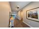 Hallway with a painting and an area to walk through the house at 32 Via Del Fiume, Henderson, NV 89011