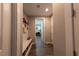 Hallway with storage, coat hooks, and a view into another room at 32 Via Del Fiume, Henderson, NV 89011