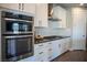 Gourmet kitchen equipped with built-in oven and sleek appliances at 32 Via Del Fiume, Henderson, NV 89011