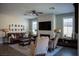 Comfortable living room with a modern fireplace and ample natural light from multiple windows at 32 Via Del Fiume, Henderson, NV 89011