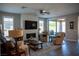 Stylish living room boasting a fireplace with a sleek, modern design at 32 Via Del Fiume, Henderson, NV 89011