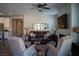 Inviting living room features a stylish fireplace and comfortable seating arrangements at 32 Via Del Fiume, Henderson, NV 89011