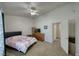 Spacious bedroom with carpet flooring, ceiling fan, and ample natural light from the window at 3581 Margarita Ave, Pahrump, NV 89048