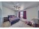 Cozy bedroom with carpet flooring, ceiling fan, and natural light, with closet at 3581 Margarita Ave, Pahrump, NV 89048