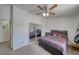Bedroom featuring carpet flooring, ceiling fan, and sliding closet doors at 3581 Margarita Ave, Pahrump, NV 89048